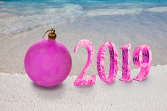 Christmas ball on the sandy seashore and the inscription 2019- New Year`s card royalty free stock photos Christmas ball on the sandy seashore and the inscription 2019- New Year`s card royalty free stock photos
