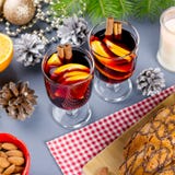 Christmas cake, two glasses of hot mulled wine with sliced orange. Christmas background with food and decorations. Top view royalty free stock photo Christmas cake, two glasses of hot mulled wine with sliced orange. Christmas background with food and decorations. Top view royalty free stock photo