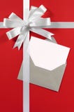 Christmas Card With White Gift Ribbon Bow On Red Paper Background Vertical Stock Photography