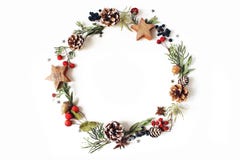 Christmas circle floral composition. Wreath of cypress, eucalyptus branches, pine cones, rowan berries, anise, confetti