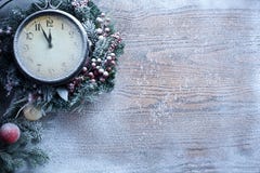 Christmas Clock Over Snow Wooden Background. Stock Photography Christmas Clock Over Snow Wooden Background. Stock Photography
