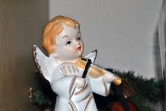 Christmas decoration of an angel doll with wings playing a violin stock photography Christmas decoration of an angel doll with wings playing a violin stock photography