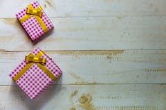 Christmas gift box. Christmas present in box at white wooden tab royalty free stock photography Christmas gift box. Christmas present in box at white wooden tab royalty free stock photography