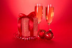 Christmas Gifts, Toys, Serpentine And Wine Glasses Royalty Free Stock Photography