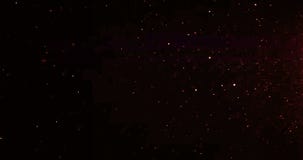 Christmas gold gradient sparkle glitter dust particles flowing on black background with bokeh flowing movement, golden holiday stock video footage Christmas gold gradient sparkle glitter dust particles flowing on black background with bokeh flowing movement, golden holiday stock video footage