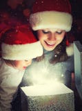 Christmas Magic Gift Box And A Happy Family Mother And Baby Royalty Free Stock Photo Christmas Magic Gift Box And A Happy Family Mother And Baby Royalty Free Stock Photo