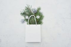 Christmas Mock Up Flat Lay With White Package And Fir Tree And Snowflakes On White Wooden Background. Modern Composition Stock Photography