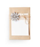 Christmas mockup Gift box wrapped in brown recycled paper and tied sack rope top view isolated on white background, with Stock Photography Christmas mockup Gift box wrapped in brown recycled paper and tied sack rope top view isolated on white background, with Stock Photography