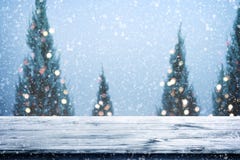 Christmas and New year background with wooden deck table over christmas tree, stock photos Christmas and New year background with wooden deck table over christmas tree, stock photos