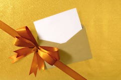 Christmas Or Birthday Card, Diagonal Gold Gift Ribbon Bow, Blank Card And Envelope, Copy Space Stock Images Christmas Or Birthday Card, Diagonal Gold Gift Ribbon Bow, Blank Card And Envelope, Copy Space Stock Images