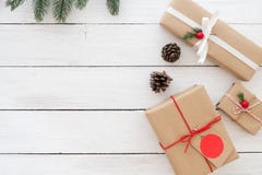 Christmas present gifts boxes with tag and decoration on white wooden background. stock photography Christmas present gifts boxes with tag and decoration on white wooden background. stock photography