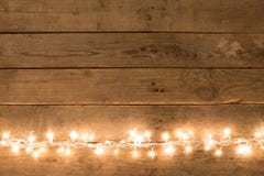 Christmas rustic background - vintage planked wood with lights and free text space Stock Photography Christmas rustic background - vintage planked wood with lights and free text space Stock Photography