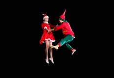 Christmas time, childhood, fairy tale. Cheerful kids - A young girl wearing a Santa`s costume and boy wearing elf stock photos Christmas time, childhood, fairy tale. Cheerful kids - A young girl wearing a Santa`s costume and boy wearing elf stock photos
