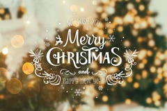 Christmas tree background and Christmas decorations with blurred, sparking, glowing and text Merry Christmas and Happy New Year royalty free stock image Christmas tree background and Christmas decorations with blurred, sparking, glowing and text Merry Christmas and Happy New Year royalty free stock image