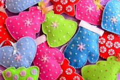 Christmas tree ornaments. Kids winter background. Cute felt Christmas trees, hearts, stars, mittens toys embellished with beads stock image Christmas tree ornaments. Kids winter background. Cute felt Christmas trees, hearts, stars, mittens toys embellished with beads stock image