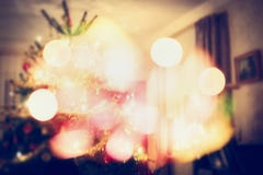 Christmas tree scene in living room with festive bokeh Stock Photos Christmas tree scene in living room with festive bokeh Stock Photos