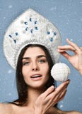 Christmas Woman. Cute Face. Healthy Skin. girl holds in her hand a Christmas tree ball. royalty free stock images Christmas Woman. Cute Face. Healthy Skin. girl holds in her hand a Christmas tree ball. royalty free stock images