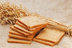 Chunks Of Bread And Ears Of Rye On Natural Background. Royalty Free Stock Image