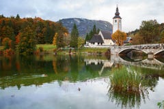 Church tower and stone bridge at Lake Bohinj stock photography Church tower and stone bridge at Lake Bohinj stock photography