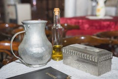 Church utensil at the table, glans, the Bible on the table, ceremony of water baptism various objects needed for baptism royalty free stock images Church utensil at the table, glans, the Bible on the table, ceremony of water baptism various objects needed for baptism royalty free stock images