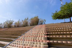 Circular stone stairs and bleachers in a park in streets of Barcelona