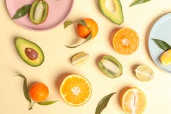 Citrus food on ligth-yellow background - assorted citrus fruits with mint leaves. Top view stock image Citrus food on ligth-yellow background - assorted citrus fruits with mint leaves. Top view stock image