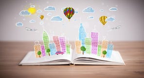 Cityscape drawing on open book
