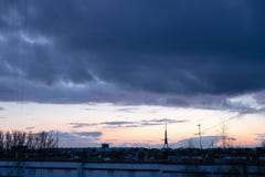 Cityscape with wonderful varicolored vivid dawn. Amazing dramatic blue sky with purple and violet clouds above dark stock photography Cityscape with wonderful varicolored vivid dawn. Amazing dramatic blue sky with purple and violet clouds above dark stock photography