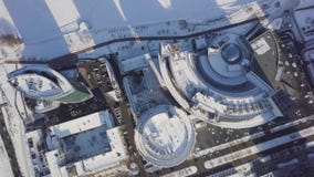 Cityscapes, high rise office buildings and skyscrapers in city, winter daylight, top view in winter. Top view of the stock video footage Cityscapes, high rise office buildings and skyscrapers in city, winter daylight, top view in winter. Top view of the stock video footage