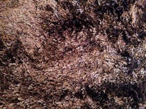 Ciérrese encima de la línea fondo de la textura de la alfombra del marrón fotografía de archivo libre de regalías Ciérrese encima de la línea fondo de la textura de la alfombra del marrón fotografía de archivo libre de regalías