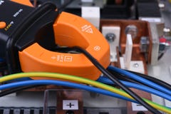 Clamp meter measure current on cable on power supply devices Stock Image Clamp meter measure current on cable on power supply devices Stock Image