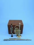 A clarinet, a trumpet and a transverse flute next to a wooden block. royalty free stock photo A clarinet, a trumpet and a transverse flute next to a wooden block. royalty free stock photo