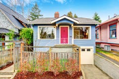 Classic American house exterior with blue trim and red front door stock photo Classic American house exterior with blue trim and red front door stock photo