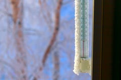 Classic mercury thermometer for measuring ambient temperature, hanging outside the window, with readings minus 50 degrees Celsius royalty free stock images Classic mercury thermometer for measuring ambient temperature, hanging outside the window, with readings minus 50 degrees Celsius royalty free stock images