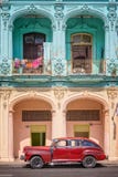 Classic vintage car and coloful colonial buildings in Old Havana Stock Images Classic vintage car and coloful colonial buildings in Old Havana Stock Images