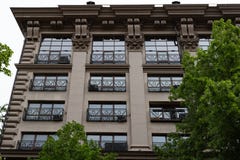 Several Windows in a row on the facade of the old building. Windows in a row on a marble wall. Rows of Windows on a tall building stock images Several Windows in a row on the facade of the old building. Windows in a row on a marble wall. Rows of Windows on a tall building stock images