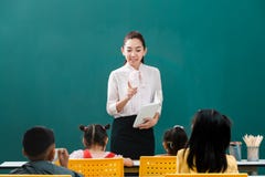 In classroom, Asian teacher teaches student royalty free stock photography In classroom, Asian teacher teaches student royalty free stock photography