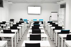 Classroom empty. High school or university desk or table with a pen on top stock photo Classroom empty. High school or university desk or table with a pen on top stock photo
