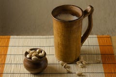 Clay glass with beer and pistachios on the table royalty free stock images Clay glass with beer and pistachios on the table royalty free stock images