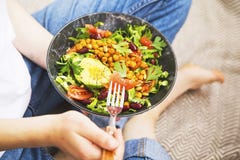 Clean eating, vegan healthy salad bowl , top view of woman holding salad bowl, plant based healthy diet with greens, salad,