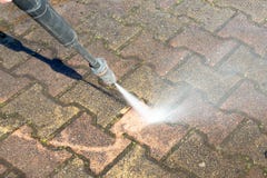 Cleaning concrete block floor by high pressure water jet outdoor stock photo Cleaning concrete block floor by high pressure water jet outdoor stock photo