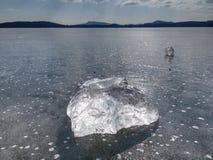 Clear Ice On Lake Against To Sky. Crystally Clean Piece Of Ice Royalty Free Stock Image