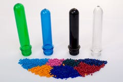 Clear PET Preforms on white background for presentation. Preforms and raw materials of different colors Stock Images Clear PET Preforms on white background for presentation. Preforms and raw materials of different colors Stock Images