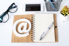 Client support service. Contact us for feedback. Desktop with notepad, smartphone, glasses and email symbol. Top view royalty free stock photography Client support service. Contact us for feedback. Desktop with notepad, smartphone, glasses and email symbol. Top view royalty free stock photography