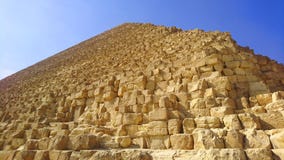 Close low angle of the Great Pyramid under blue skies at Giza, Egypt royalty free stock photo Close low angle of the Great Pyramid under blue skies at Giza, Egypt royalty free stock photo