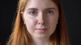 Close shot of charming ginger woman opening eyes and looking at camera, beauty portrait stock footage Close shot of charming ginger woman opening eyes and looking at camera, beauty portrait stock footage