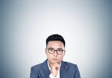 Close up of Asian businessman in glasses stock photo Close up of Asian businessman in glasses stock photo