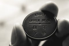 A close up black and white shot of a token for the Hong Kong Star Ferry royalty free stock photography A close up black and white shot of a token for the Hong Kong Star Ferry royalty free stock photography