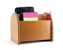 Close-up brown plywood desk organizer with office supplies isolated on white background Royalty Free Stock Photos Close-up brown plywood desk organizer with office supplies isolated on white background Royalty Free Stock Photos