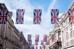 Close up of buildings on Regent Street London with row of British flags to celebrate the wedding of Prince Harry to Meghan Markle Stock Images Close up of buildings on Regent Street London with row of British flags to celebrate the wedding of Prince Harry to Meghan Markle Stock Images